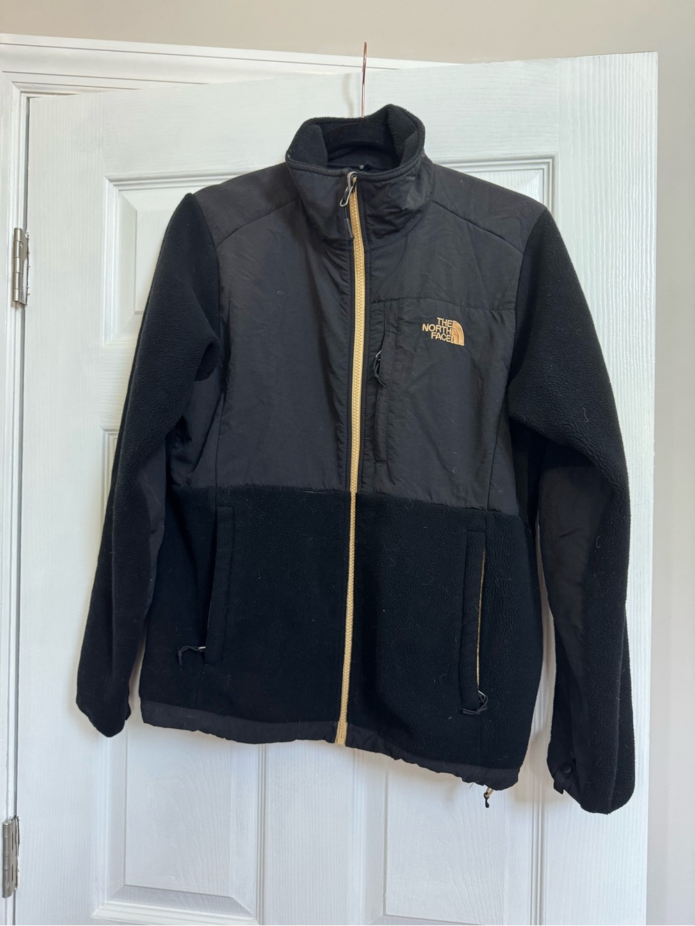 The North Face Black Fleece Jacket with Gold Accents